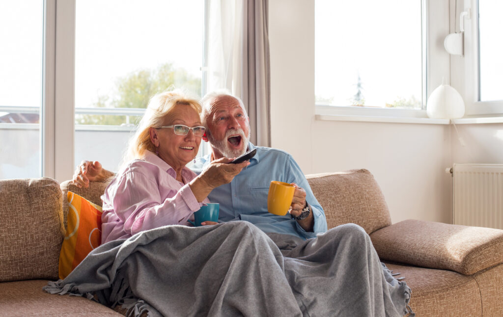 Senior couple watching tv